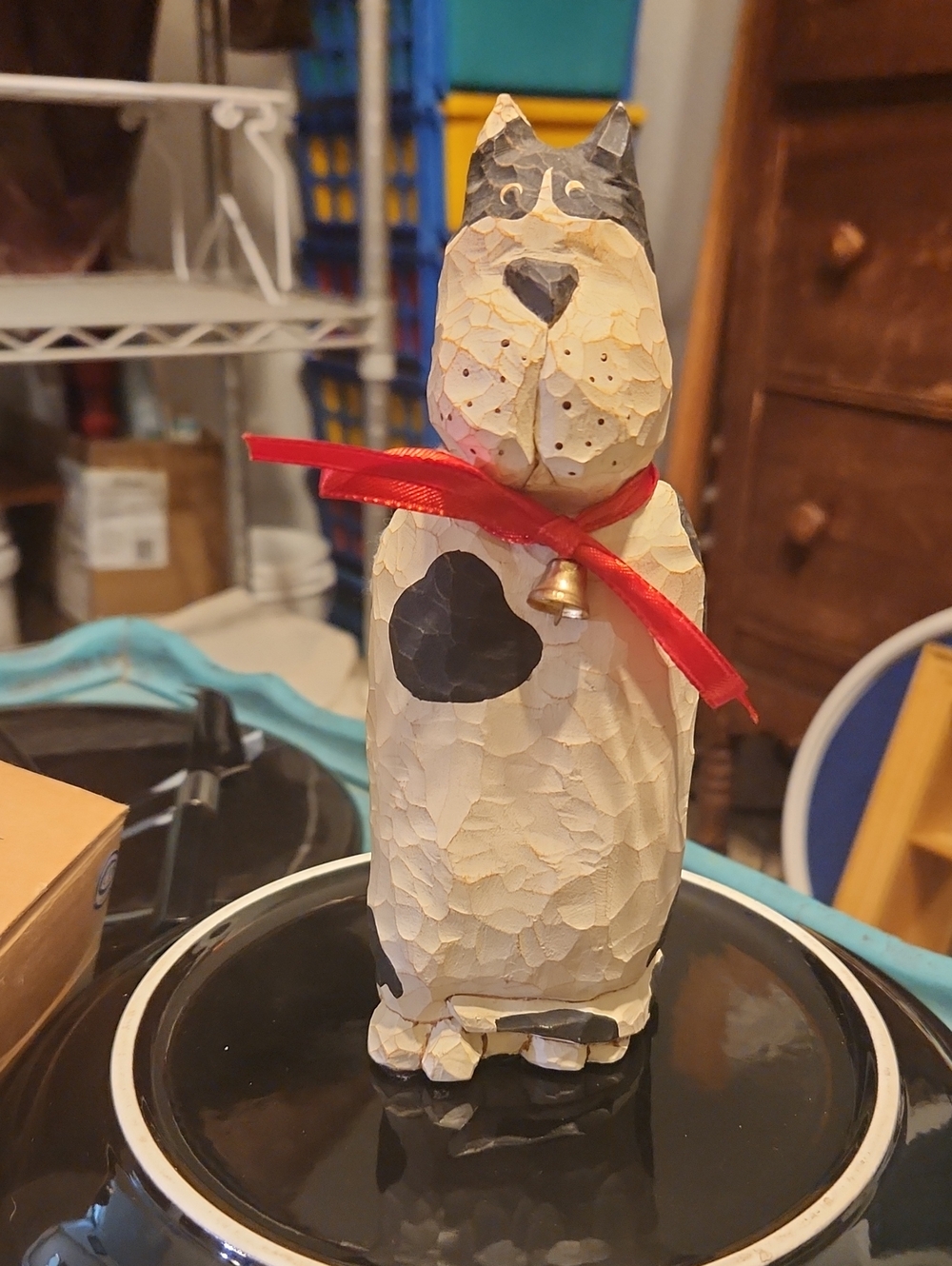 Hand-Carved Cream and Black Dog Figurine with Red Ribbon
